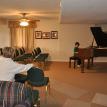 Matthew performing in the student concert room.